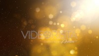 Golden abstract motion background with particles, lights and snow.