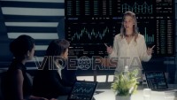 Corporate Meeting Room: Professional Female Executive presents Company Positive Results to Clients and Partners  on a large Monitor with Graphs and Charts. Shot on ARRI ALEXA Mini UHD Camera.