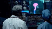 Surgeons Analyze Possible Brain Tumor In a Futuristic Digital Screen.