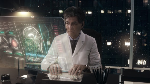 Medical Scientist interpreting  CT / MRI Brain Scan Images on a Transparent Display Computer at his office working late at night.