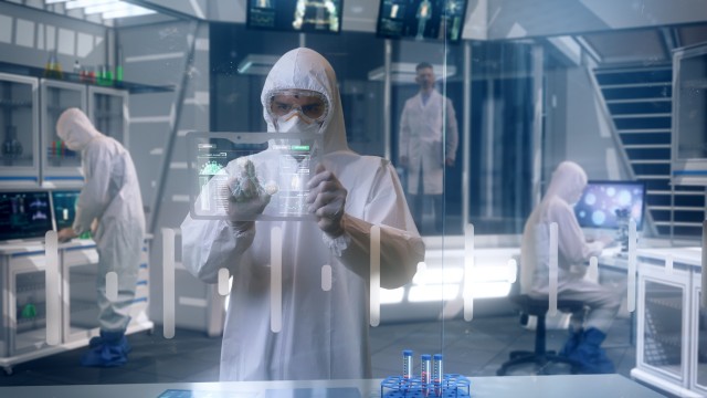 Inside Quarantine Secure High Level Laboratory Scientists in a Coverall Conducting a Research Trying to Make Coronavirus Disease Treatment.