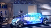 Engineers analyzing holographic futuristic car through a digital screen.