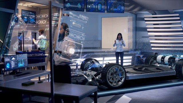 Engineers analyzing holographic futuristic detailed car through a digital screen.
