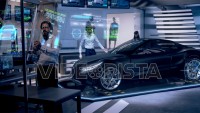 Engineers analyzing futuristic black car and futuristic with digital screens.