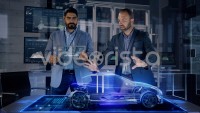 Professional Male Automotive Designers makes gestures and redesigns 3D Electric Concept Car Model
