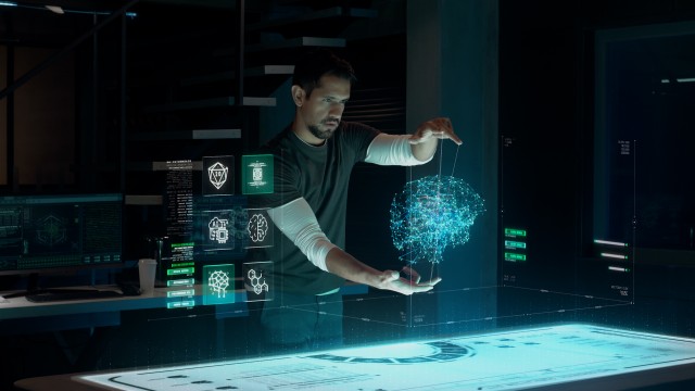 Computational Scientist works with Holographic Brain Interface and Infographics at Modern High Tech Research Facility. Futuristic Augmented Reality Technology. Blockchain and Neural AI Concept